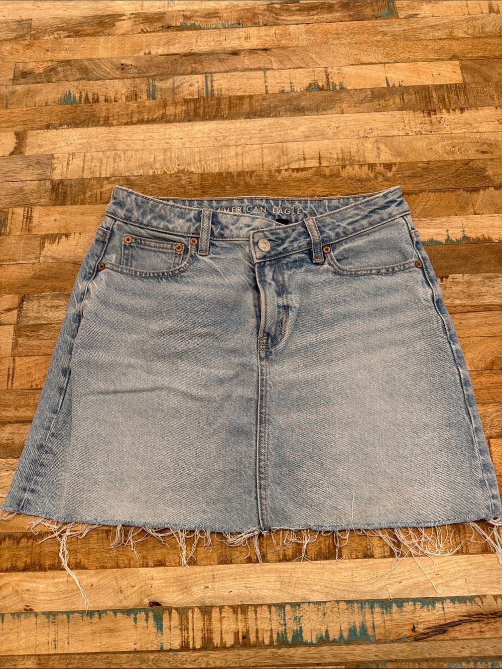 American Eagle Outfitters light wash denim skirt with raw hem
